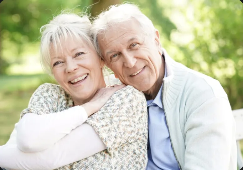 Smiling senior couple enjoying their healthy smiles