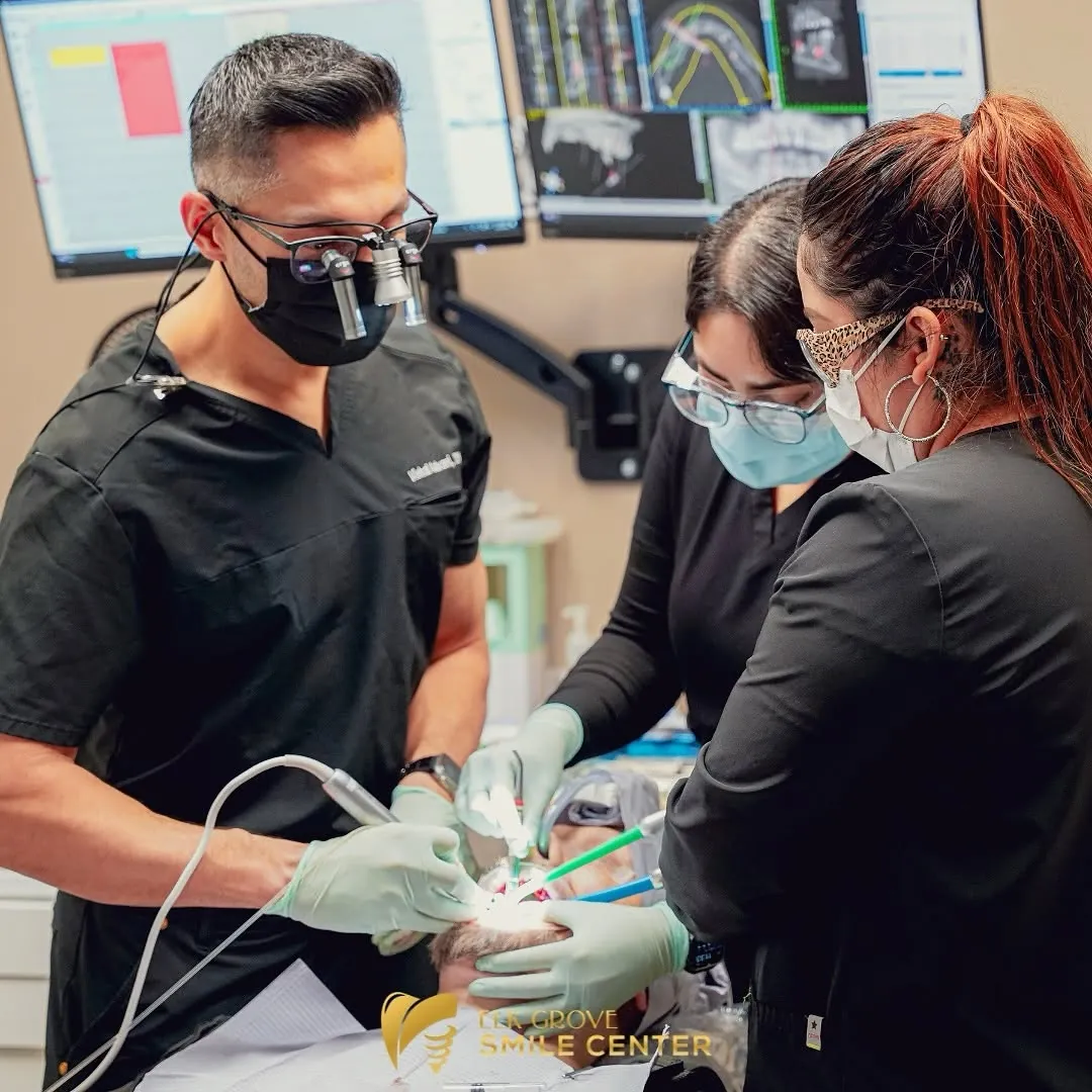 Dr. Vishal Advani and his assistants treating a patient