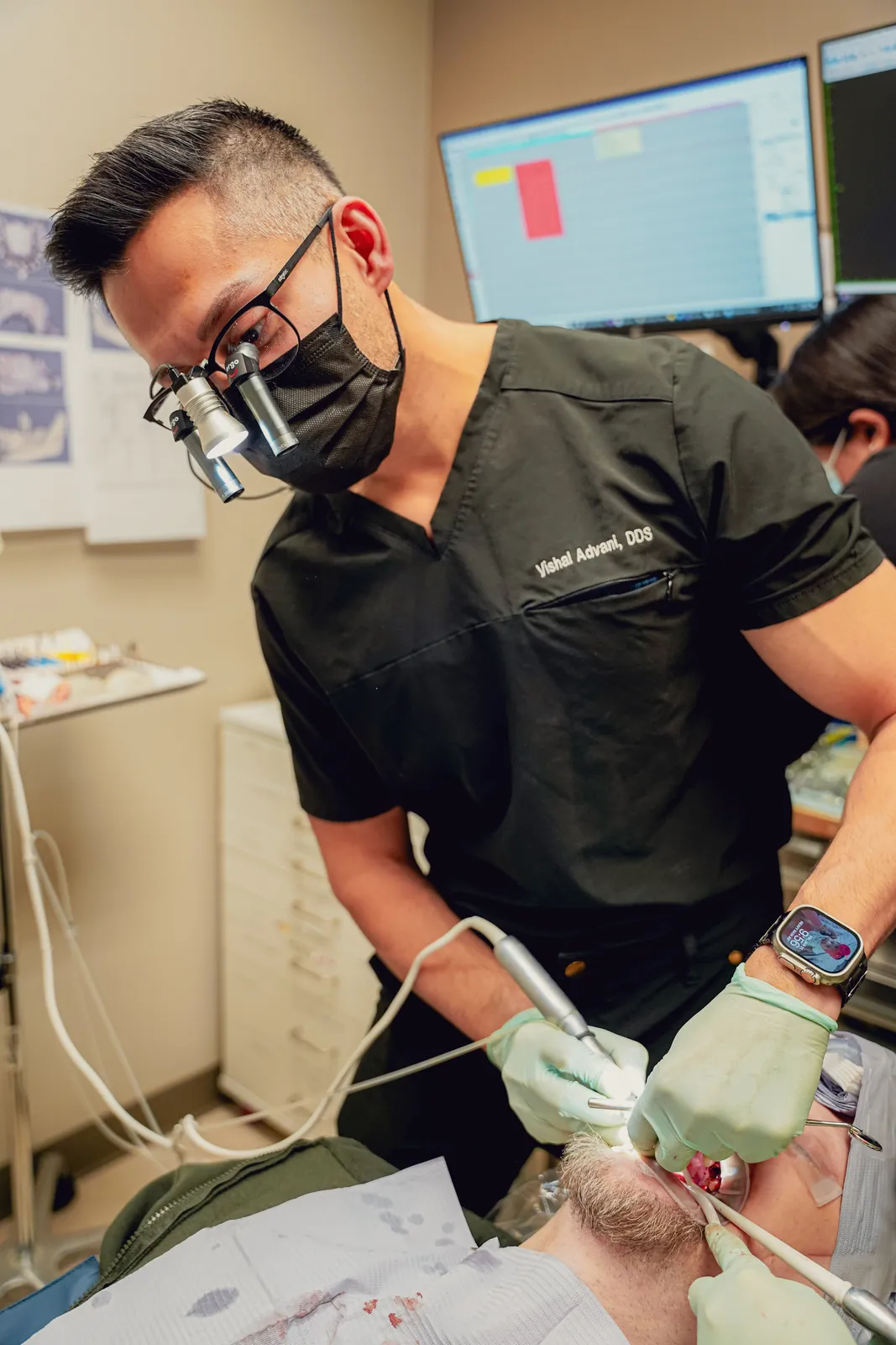 Dr. Vishal Advani treating a patient