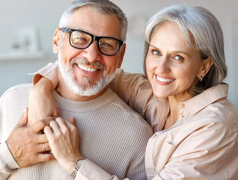 Smiling senior couple embracing