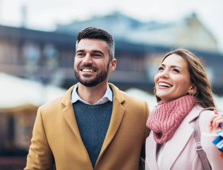 Smiling couple walking outdoors