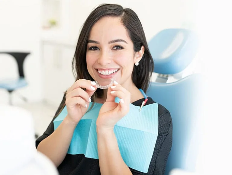 Smiling patient in the dental chair
