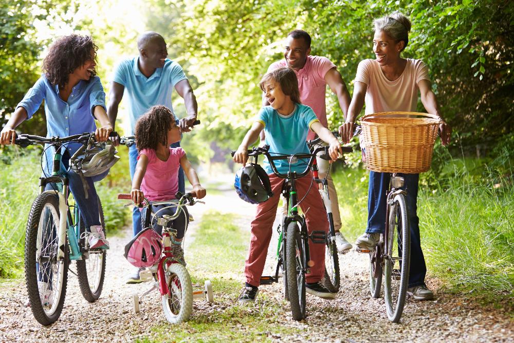 large family riding bikes outside | pediatric dentist elk grove village
