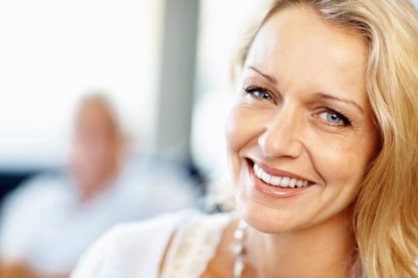 Woman smiling after root canal therapy at Elk Grove Smile Center