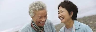 Ladies laughing after dental cleaning in Elk Grove Village, IL