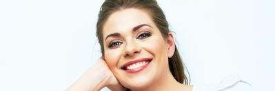 woman smiling after getting Invisalign clear aligners at Elk Grove Smile Center