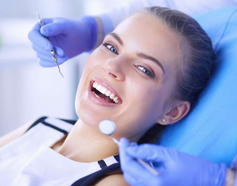 A woman with Dentist in Elk Grove Village, IL
