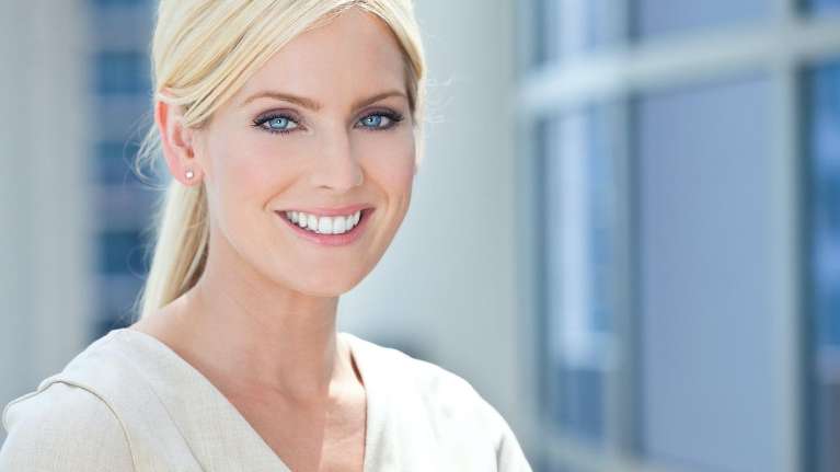 Lady smiling after BOTOX Cosmetic treatment at Elk Grove Smile Center