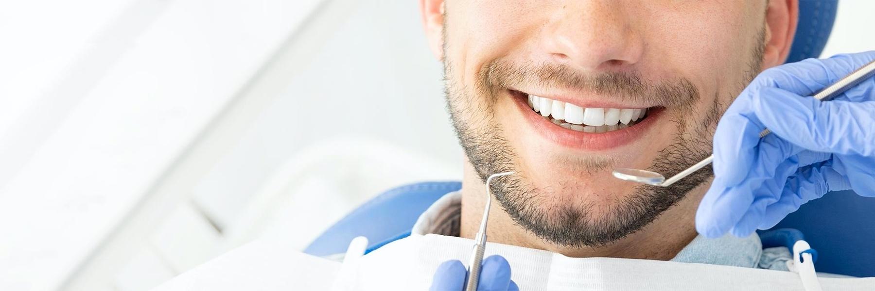Man undergoing examination at Elk Grove Smile Center