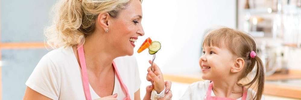 Kid feeding her mother in Elk Grove Village, Illinois
